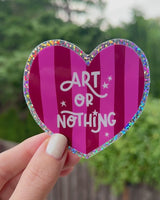 Cute "Art or Nothing" sticker with a pink striped background and a glitter edge