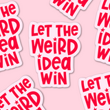 Stickers with 'Let the Weird Idea Win' text on a pink background