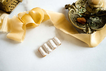 ceramic paintbrush rest with gold details