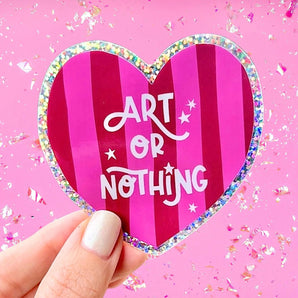 Heart-shaped sticker with 'Art or Nothing' text on a pink background