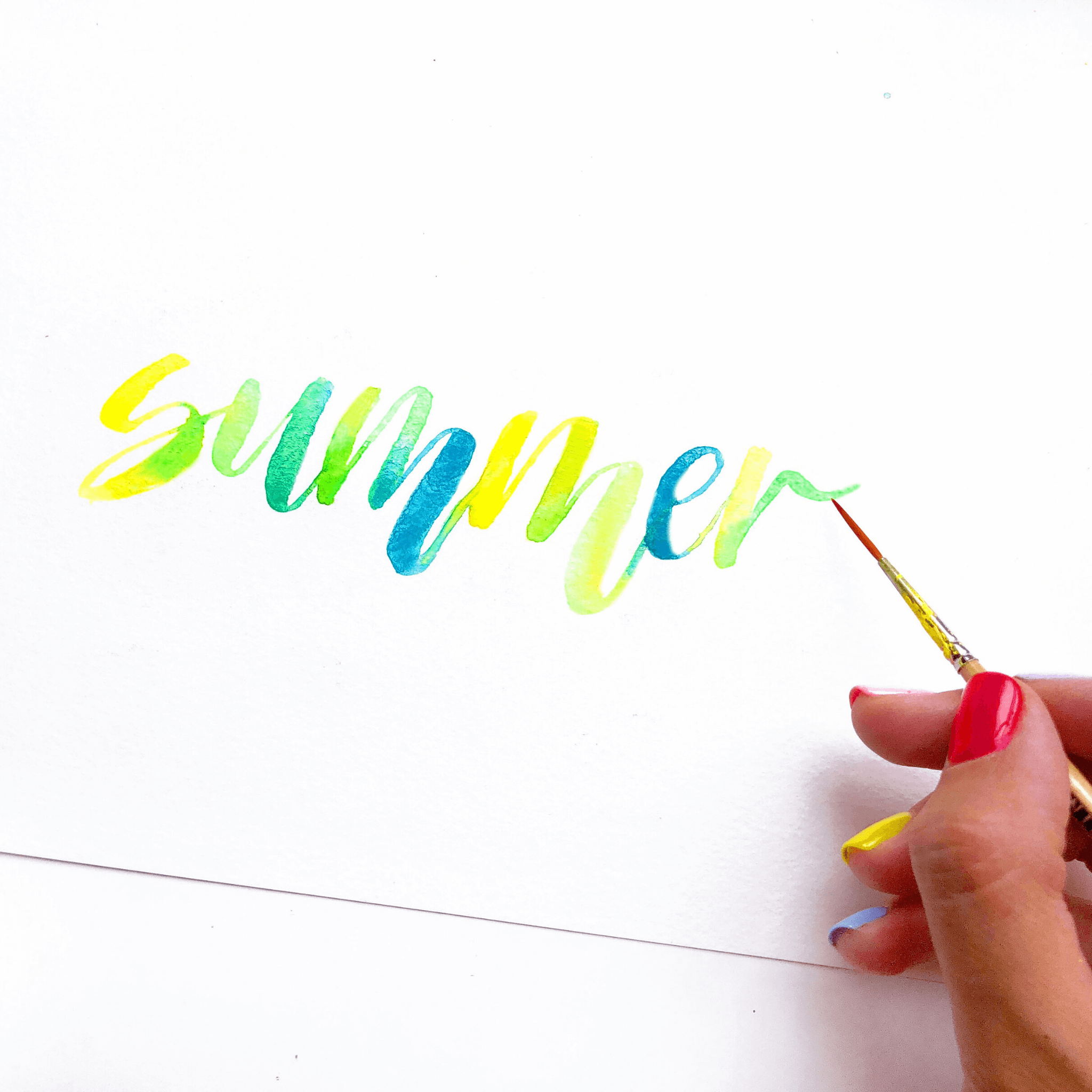 Vibrant watercolor lettering spelling "summer"